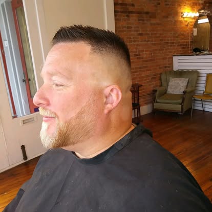 Short haircut with a carefully shaped beard