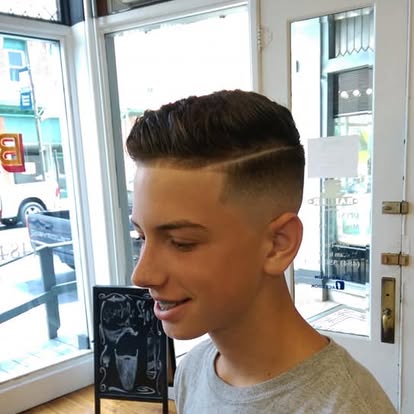 Youth haircut with a defined side part