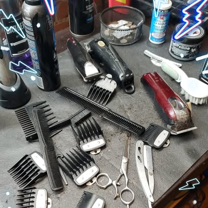 Clippers, combs, scissors, and guards at a Masters station